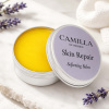 Camilla of Sweden Skin Repair Balm i miljöbild Skin Repair Softening Balm i öppen silverburk med lavendel