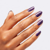 OPI Wicked Head Shiztress - Lila nagellack med guldskimmer Djup lila nagellack med guldskimmer från OPI Wicked-serien, för en mystisk och självsäker look med förtrollande effekt.