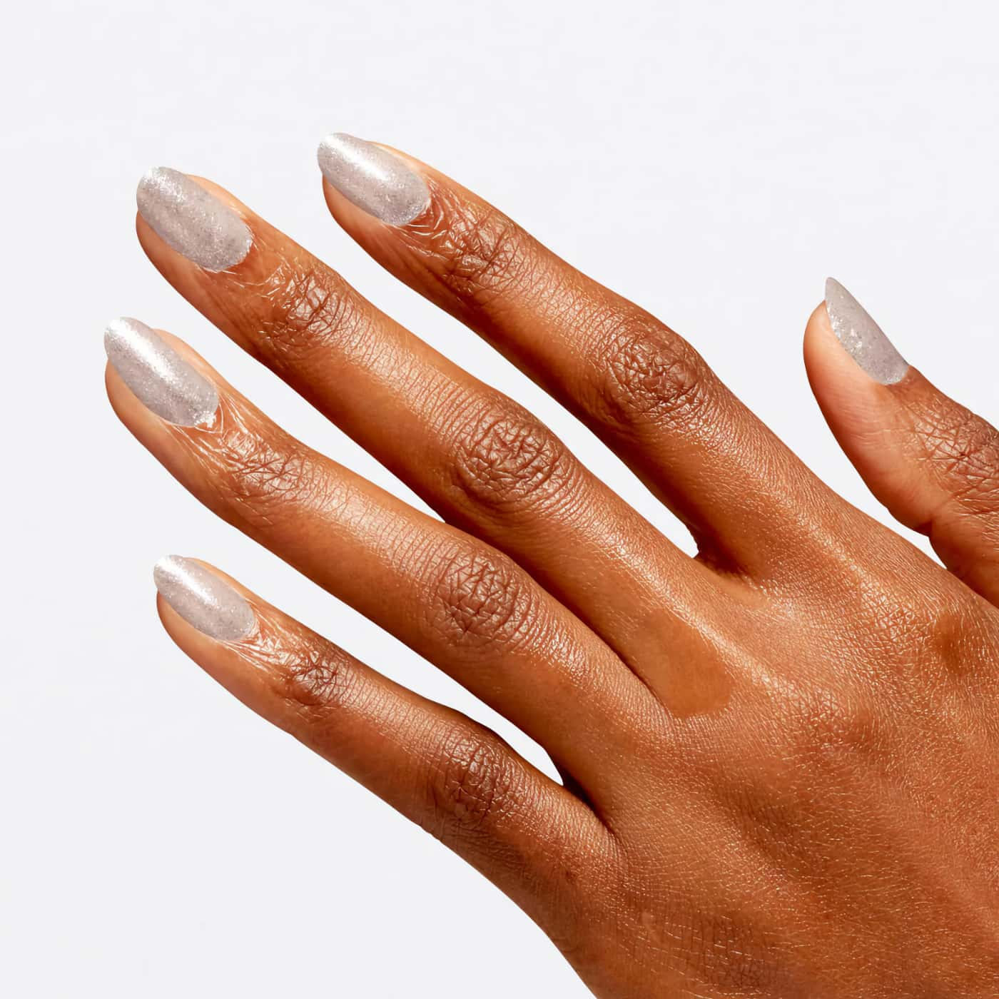 Transparent nagellack med blått, grönt och silvrigt glitter från OPI Wicked-serien, perfekt för en skimrande, magisk look.