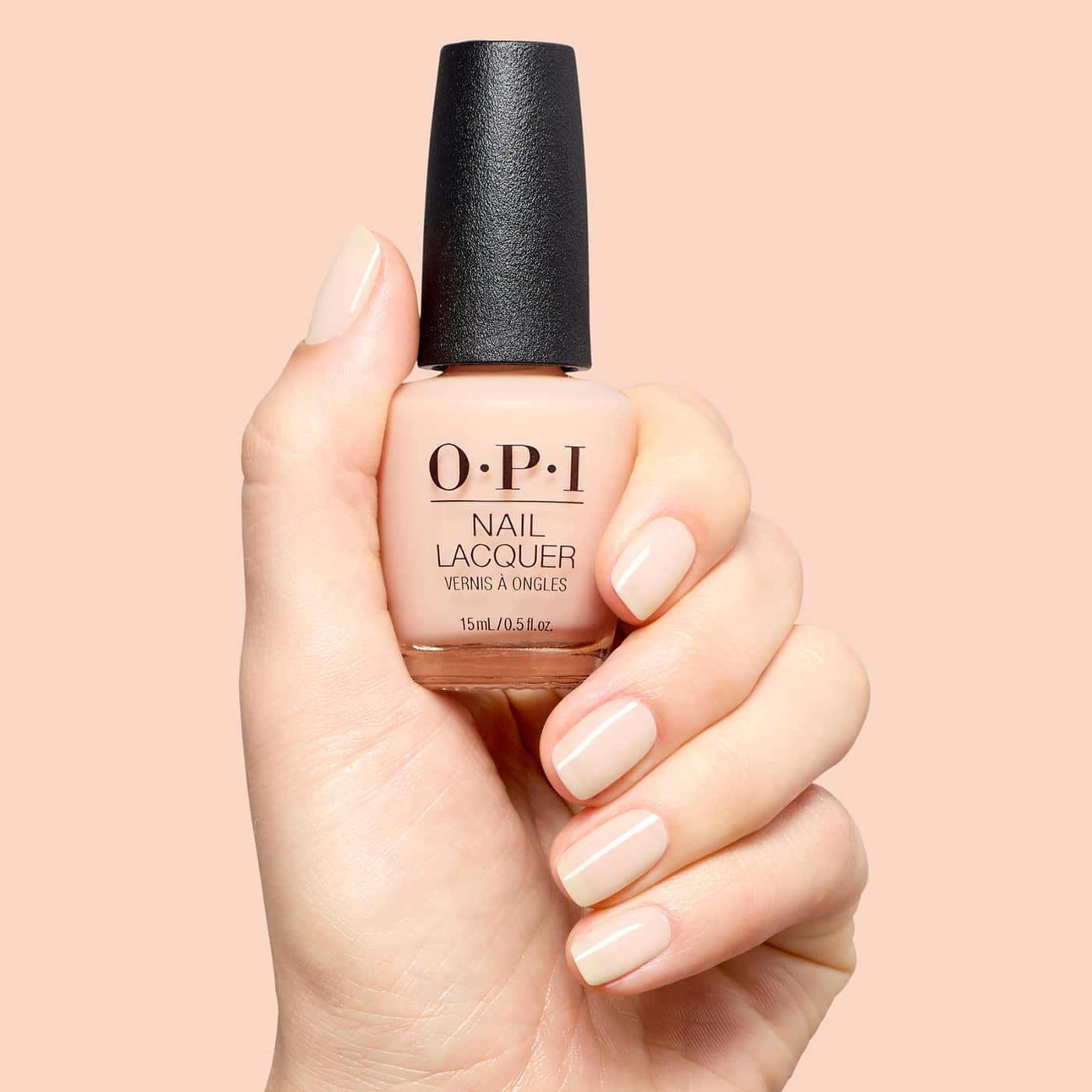 opi most requested throw me a wink nagellack i ljus beige nude med varm underton och skir, mjukt glansig finish på nageln